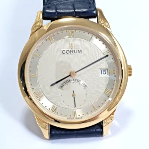 corom automatic 100 18k gold
