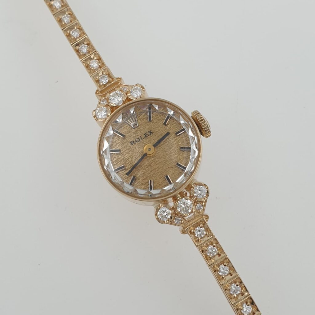 Lady Vintage Rolex Textured Dial Manual Watch 14k Yellow Gold with Tennis Diamonds Circa 1950s